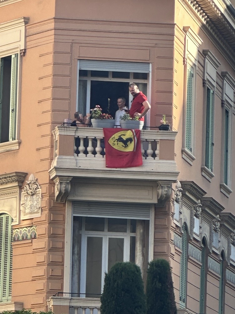 Ferrari Fans Celebrating on a Balcony